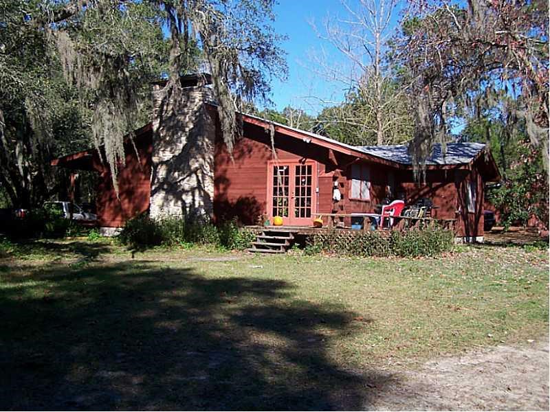 Horse Farm For Sale with 49 stalls, arena, and Cedar Home near Deland, FL - $495,000