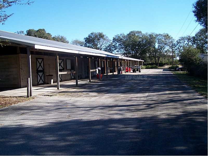 Horse Farm For Sale with 49 stalls, arena, and Cedar Home near Deland, FL - $495,000