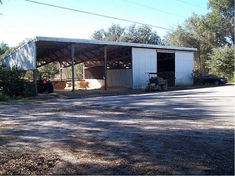 Horse Farm For Sale with 49 stalls, arena, and Cedar Home near Deland, FL - $495,000