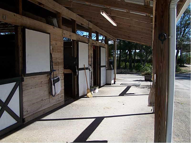 Horse Farm For Sale with 49 stalls, arena, and Cedar Home near Deland, FL - $495,000