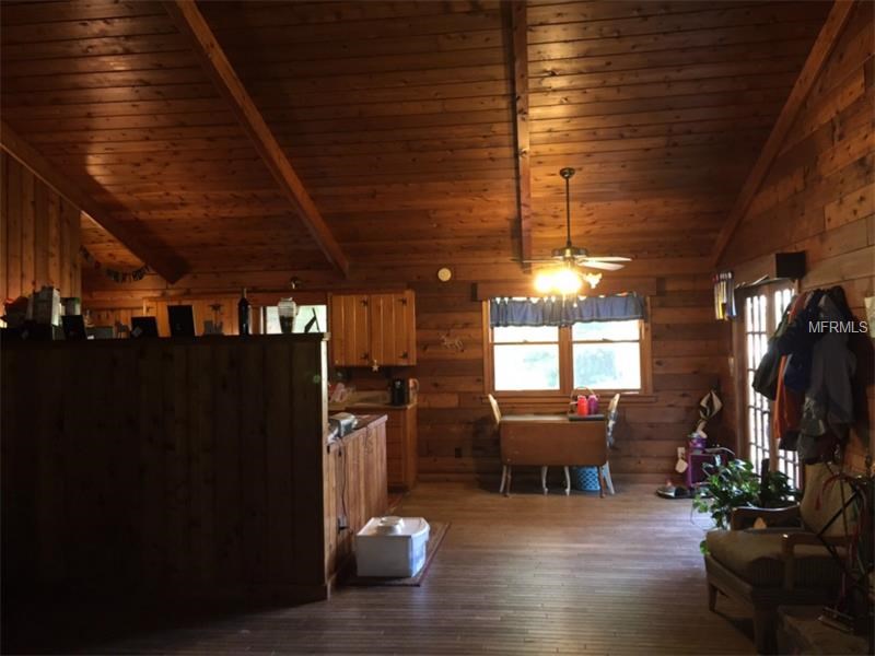 Horse Farm For Sale with 49 stalls, arena, and Cedar Home near Deland, FL - $495,000