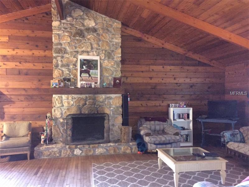 Horse Farm For Sale with 49 stalls, arena, and Cedar Home near Deland, FL - $495,000